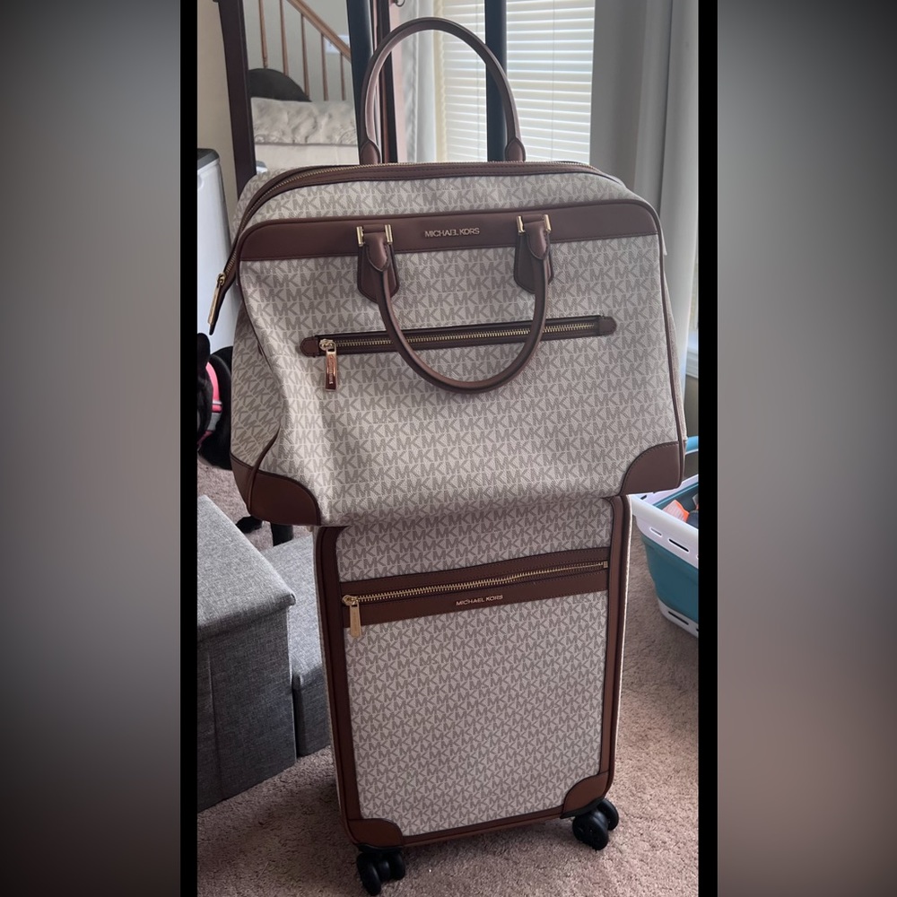 Brand New Never Used Michael Kors rolling luggage and weekender carry on